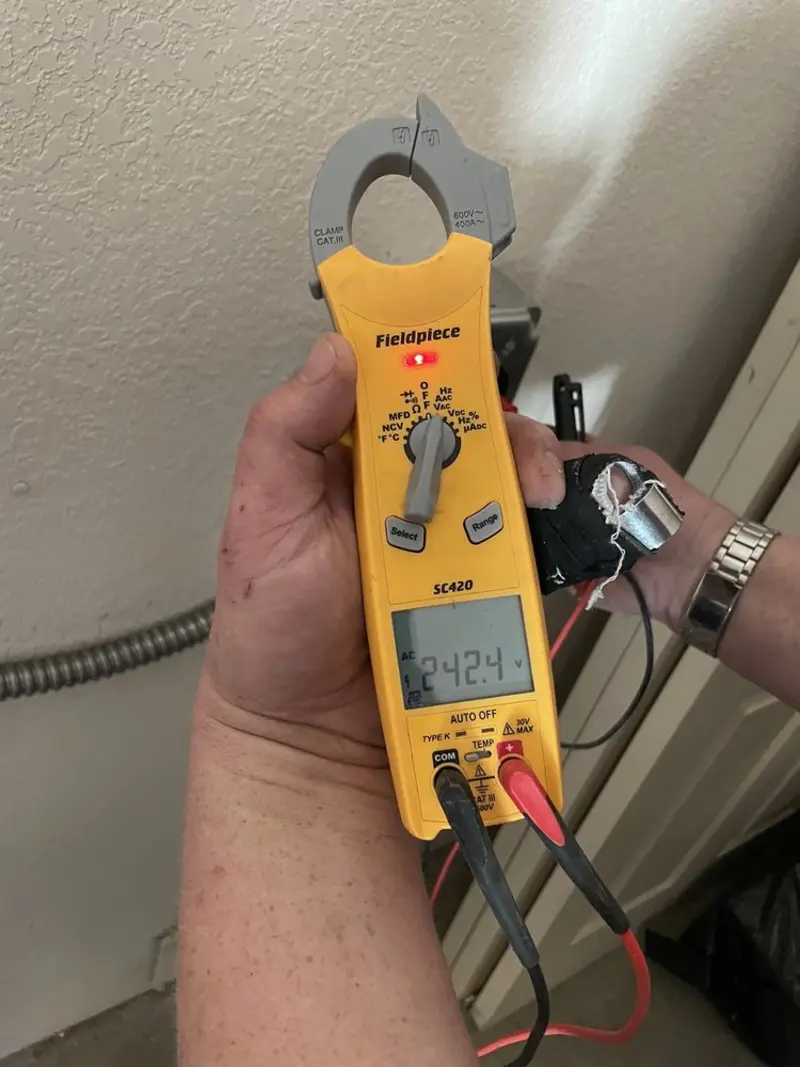 Voltage testing with clamp meter during Whole House Surge Protector in Barron